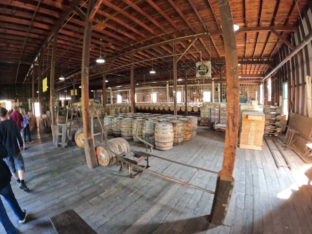 Walking through rows of aging whiskey barrels during the Trace Tour on the buffalo-trace-kentucky-bourbon-trail.