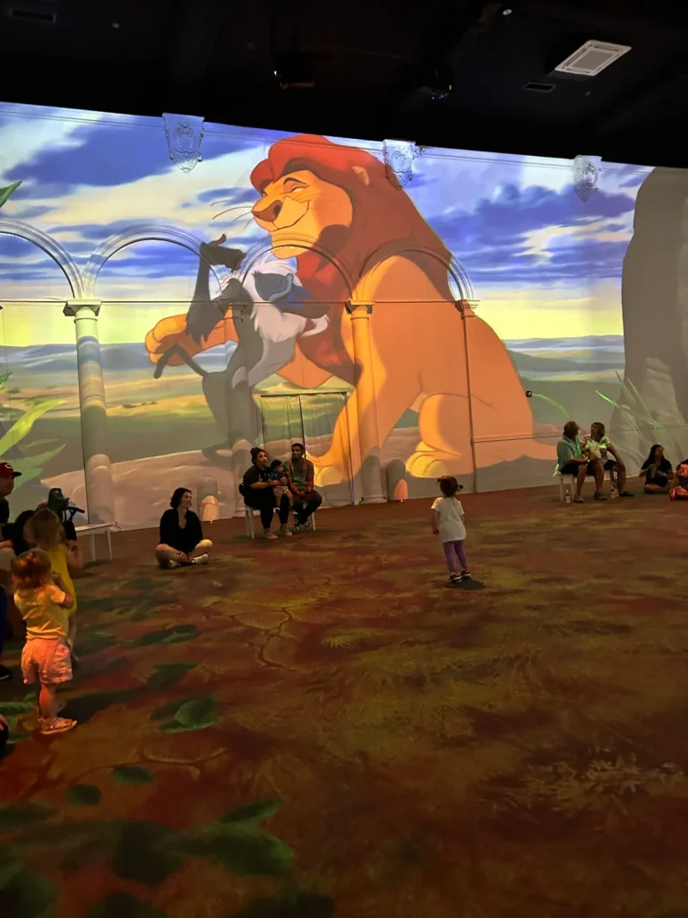 One of our favorite segments for the experience was one of the first ones, The Lion King. The opening sequence of the movie surrounds you with all the color and fantastic soundtrack. Young children walking across the illuminated floor during The Lion King projection scene at the Disney Animation Immersive Experience worth seeing.