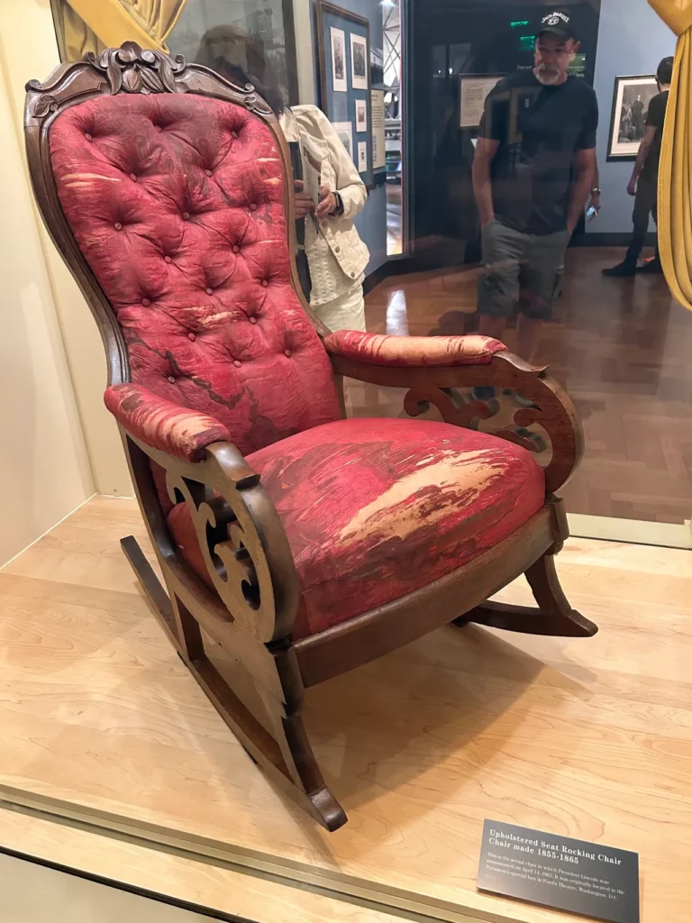 The actual chair that President Abraham Lincoln was seated in, watching a play at Ford's Theatre in Washington DC when John Wilkes Booth pulled the trigger. This is a part of a collection about Lincoln on display. The actual historic rocking chair Abraham Lincoln was seated in at Ford's Theatre, displayed at the Henry Ford Museum Detroit.