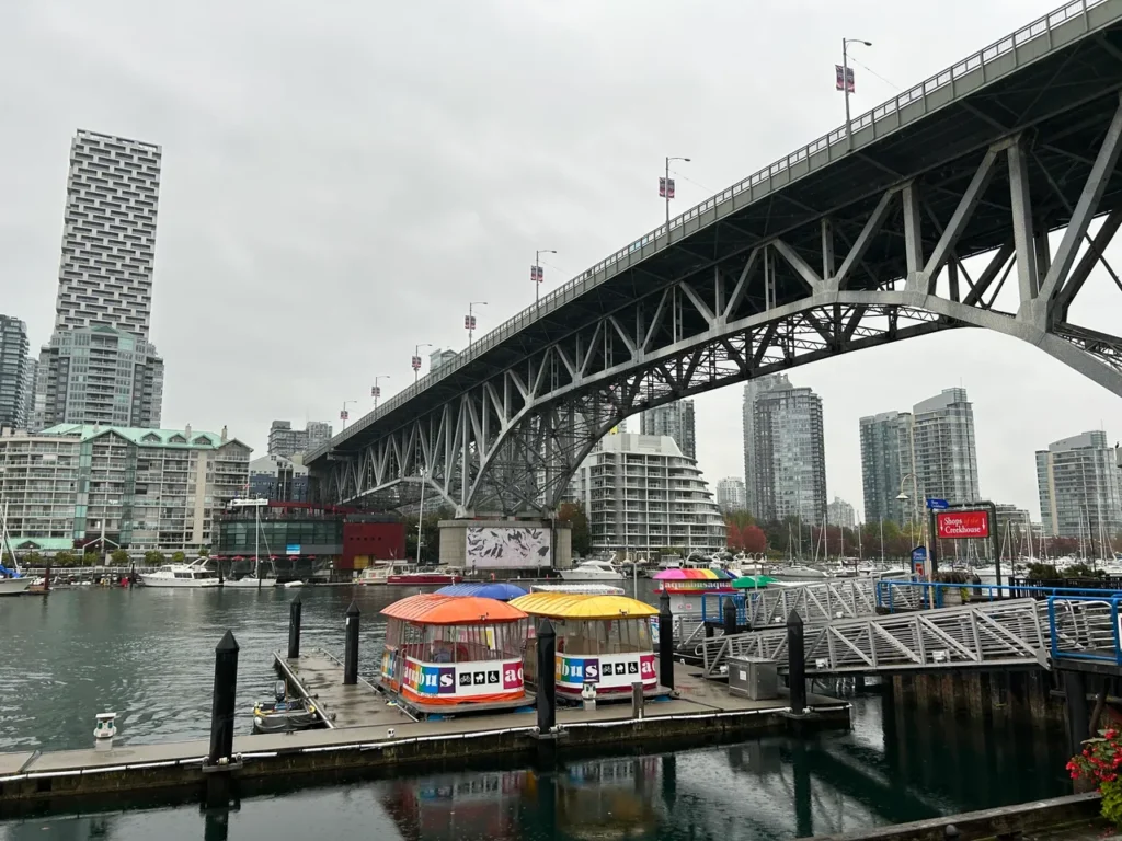 Looking back towards downtown Vancouver, this is the backside of Granville Market. The market is easily accessible via the False Creek Ferry system if you want a boat ride while you visit. Looking back towards downtown from the backside of the market building on a Granville Market food tour Vancouver.