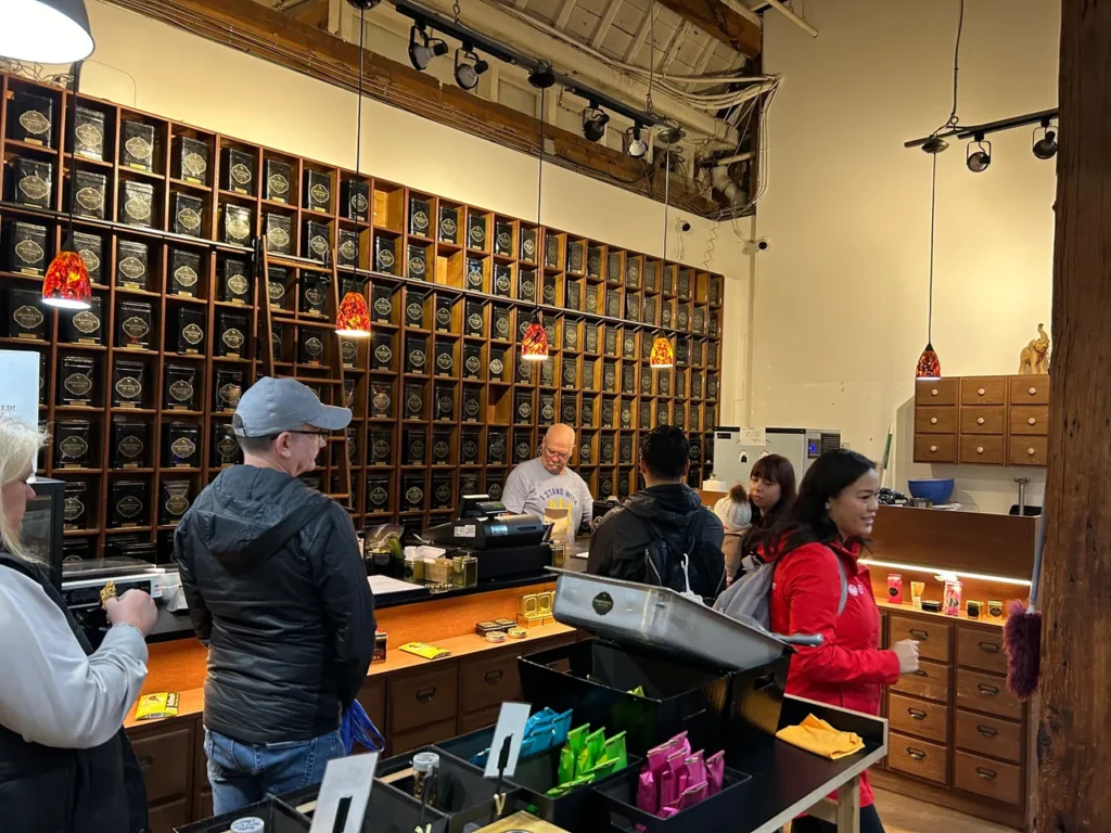 The tea library at Granville Tea Company shows the wide selection of teas to choose from during your visit. The massive loose-leaf tea library wall at the Granville Island Tea Company sampled during a Granville Market food tour Vancouver.