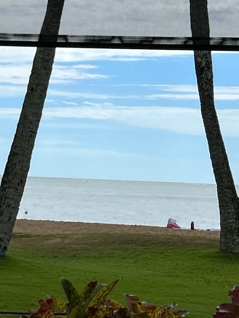 The picture-perfect beach view just steps away from Duke's Restaurant, a great lunch stop after a private air tour Kauai.