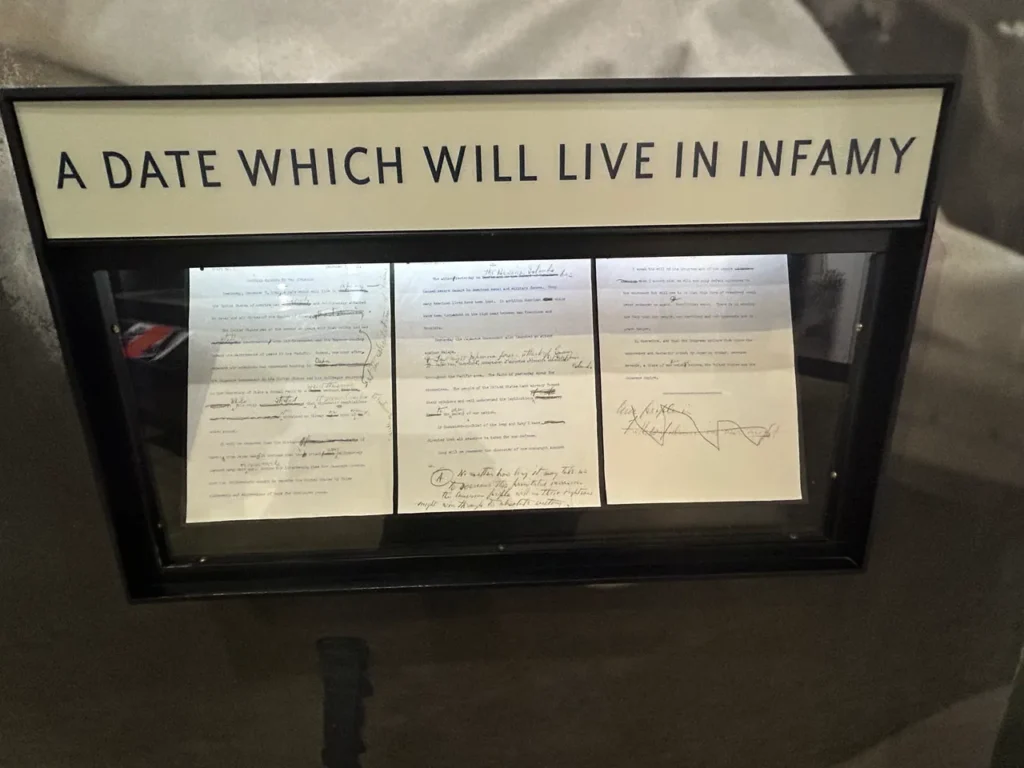 On display at the visitor’s center at Pearl Harbor is the speech given by FDR to Congress, declaring war on Japan and calling the attack “a date which will live in infamy.” President Franklin D. Roosevelt's historic "Day of Infamy" speech draft on display in the museum at the Pearl Harbor Memorial Hawaii.