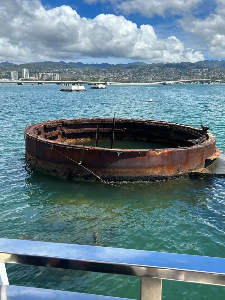 What makes the USS Arizona Memorial unique is that it is a floating memorial above the remains of the USS Arizona and those that perished during the bombing. The unique layout of the floating monument positioned directly over the sunken battleship at the Pearl Harbor Memorial Hawaii.