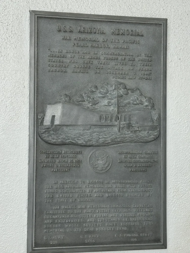 One of the plaques onboard of the USS Arizona Memorial in Pearl Harbor, Hawaii. A dedicated historical bronze plaque mounted onboard the floating shrine at the Pearl Harbor Memorial Hawaii.