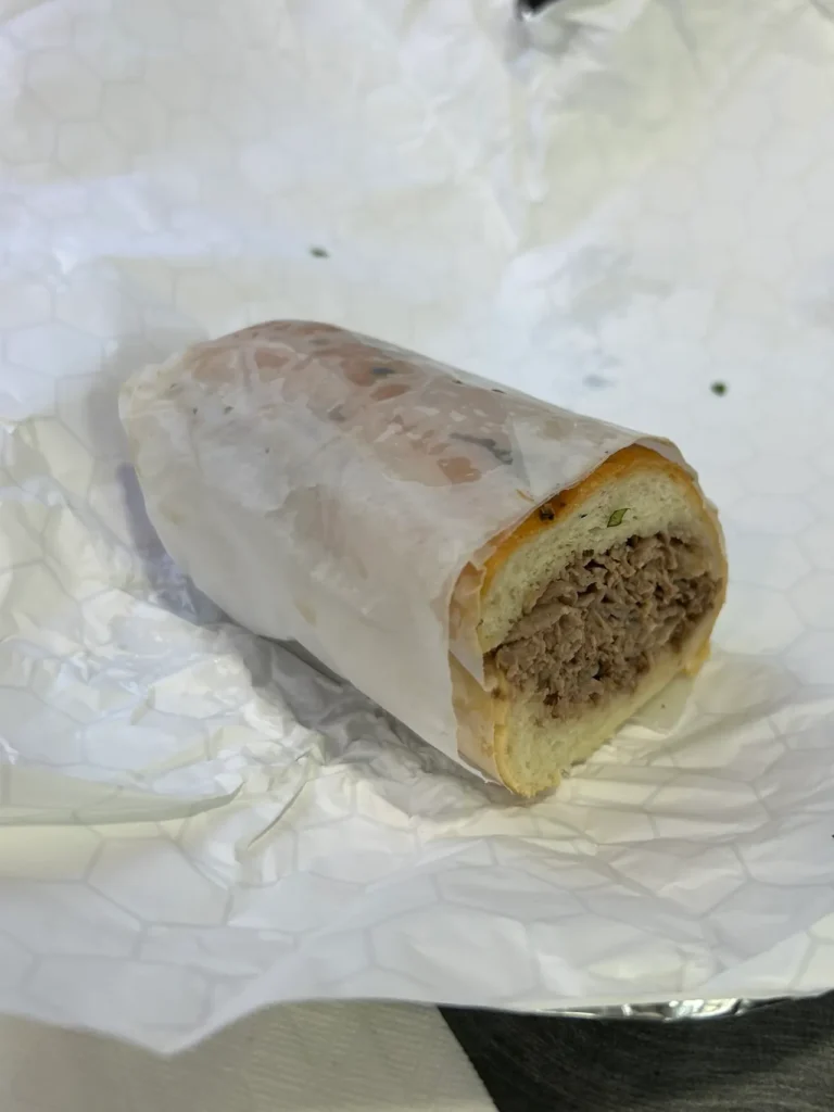 Chicago's iconic Italian beef sandwich, as served at Jimmy's Gyros in downtown Chicago. A classic juicy Chicago Italian beef sandwich served at Jimmy's Gyros & Grill during the Secret Food Tour Chicago.