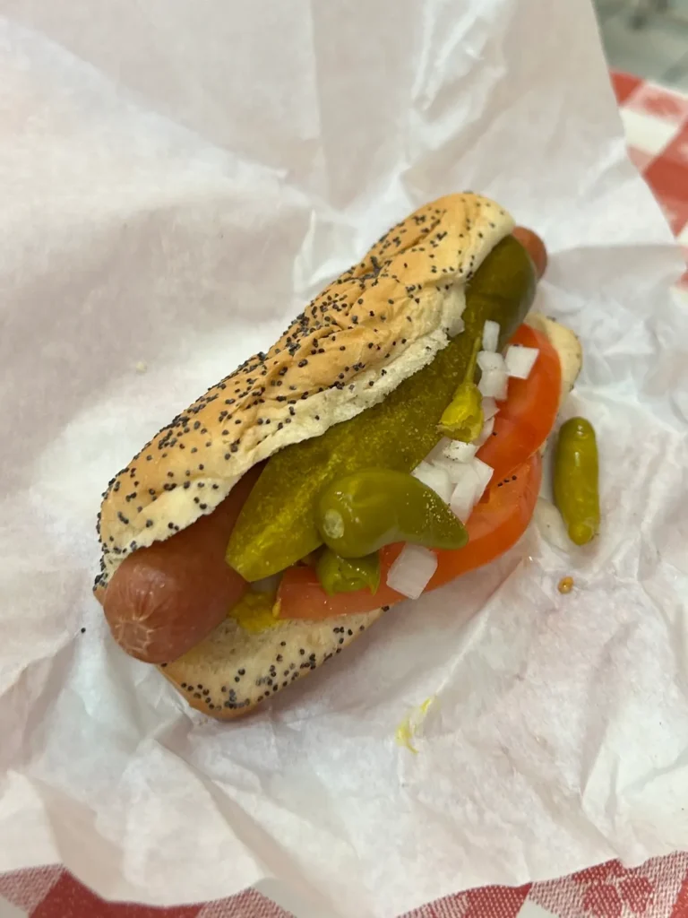 No ketchup to be found, promise! A proper Chicago dog from Luke's loaded with all the toppings. A proper, fully loaded Chicago-style hot dog on a poppy seed bun from Luke's on the Secret Food Tour Chicago.