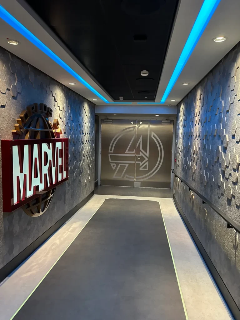 The futuristic metallic entrance corridor to the Worlds of Marvel restaurant highlighted in our Disney Wish dining guide.