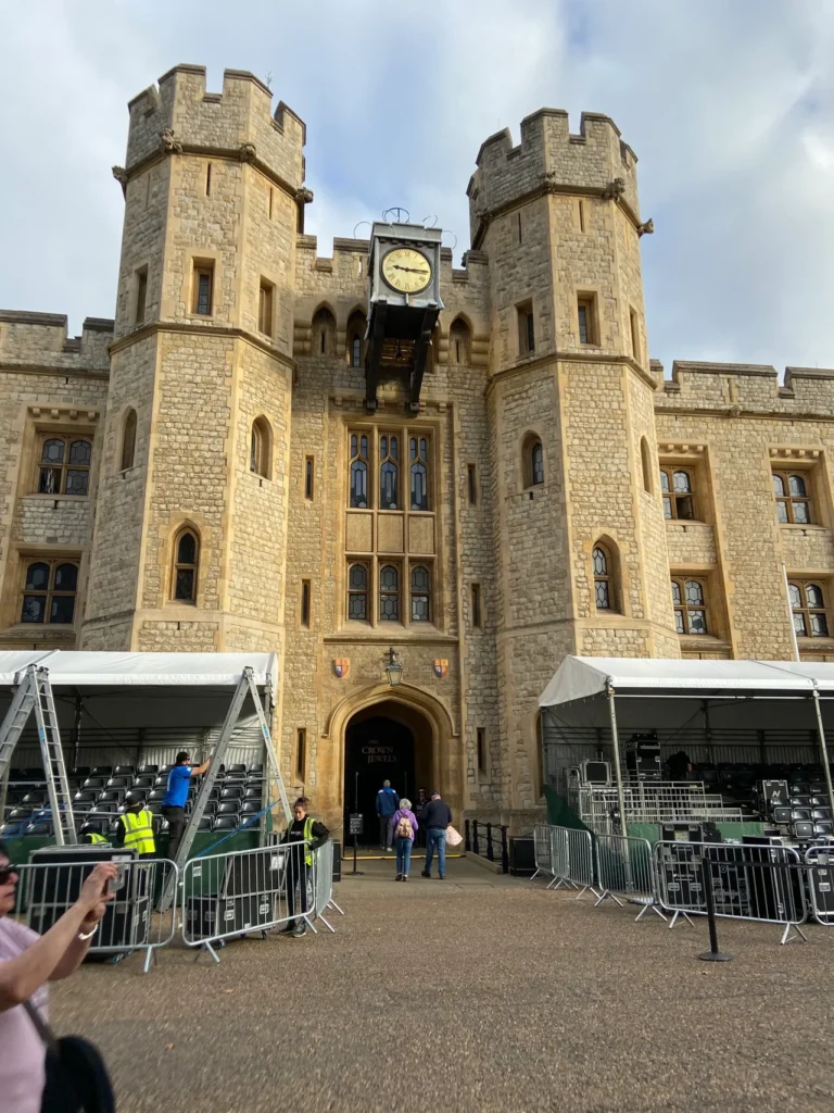 One of the many buildings within the Tower of London is the Jewel House. You can see all of crowns, scepters and other jewel encrusted items belonging to the royal family. No photography is allowed inside the Jewel House. Visitors entering the modern security courtyard in front of the historic Jewel House at the Tower of London planning guide complex.