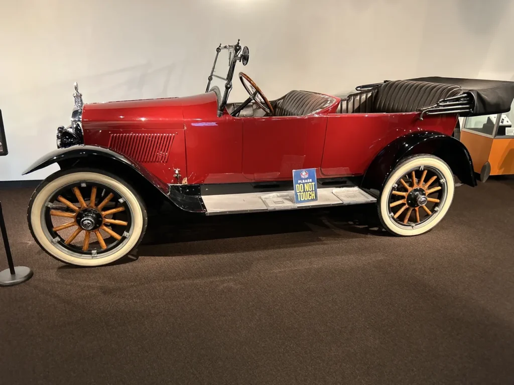 The initial meeting that formed the NFL was at a Hupmobile Auto Dealership in Canton, Ohio. They pay homage to that history with this historic car on display in the lobby of the museum. A vintage red 1920 Hupmobile on display in the lobby at the Pro Football Hall of Fame Canton.