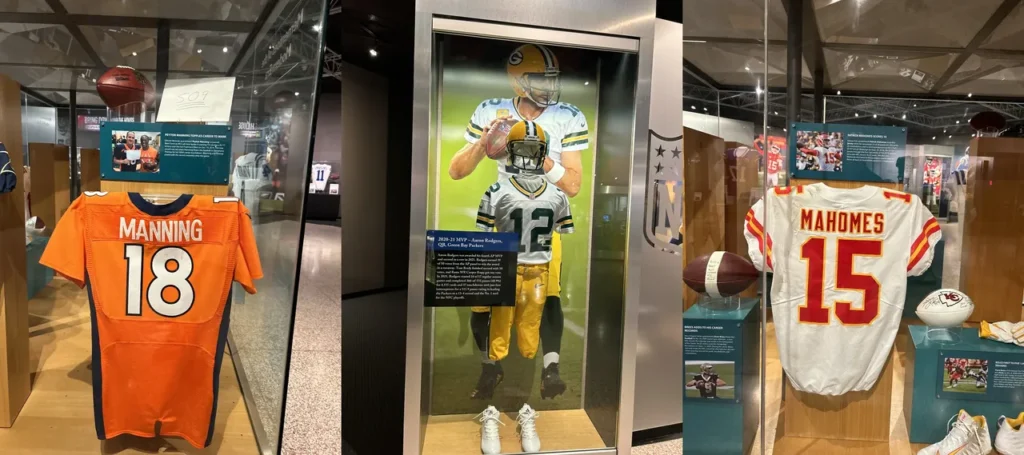 The Hall of Fame has several features on some recent quarterback greats and current ones too. Peyton Manning, Aaron Rodgers, and Patrick Mahomes are a few of the QBs with displays featuring game-worn jerseys. Game-worn jerseys of Peyton Manning, Aaron Rodgers, and Patrick Mahomes on display at the Pro Football Hall of Fame Canton.