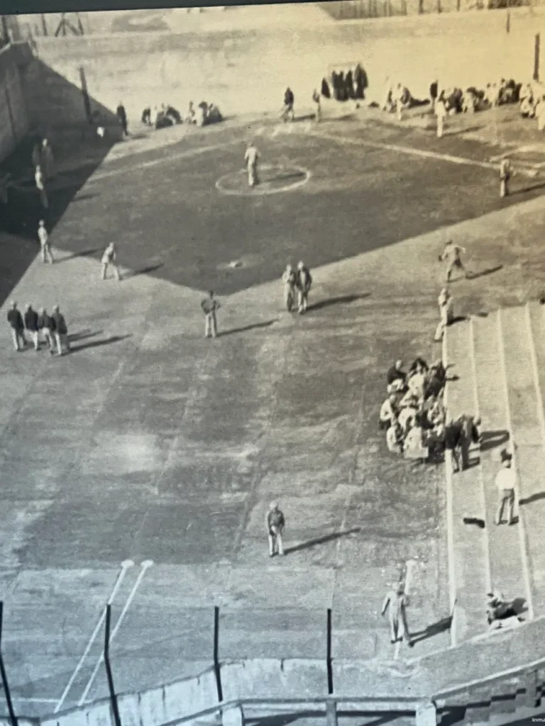 One of the photos on display from the National Parks Service is the courtyard at Alcatraz. You can see the prisoners playing baseball, with the steps causing a hazard in left field. A historic photograph on display showing inmates playing a game of baseball in the recreation yard at Alcatraz Prison San Francisco.