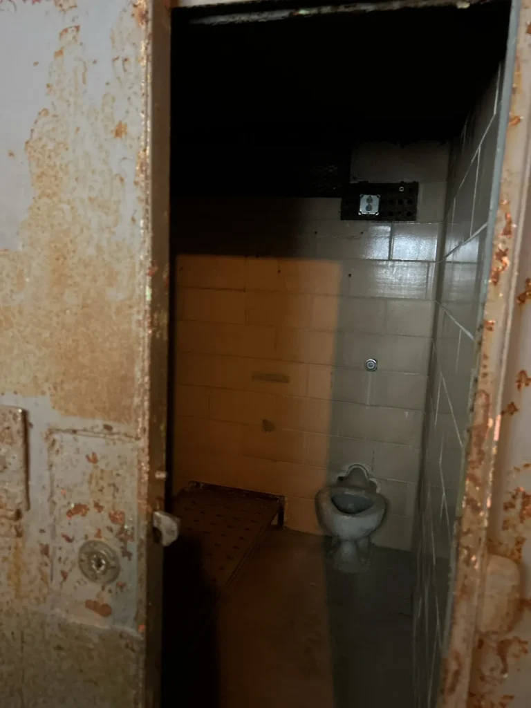 Solitary confinement at Alcatraz. A dark, isolated cell with only a few minutes of fresh air was the routine for those unfortunate prisoners. A view into a dark, rusted solitary confinement isolation cell used for punishments at Alcatraz Prison San Francisco.