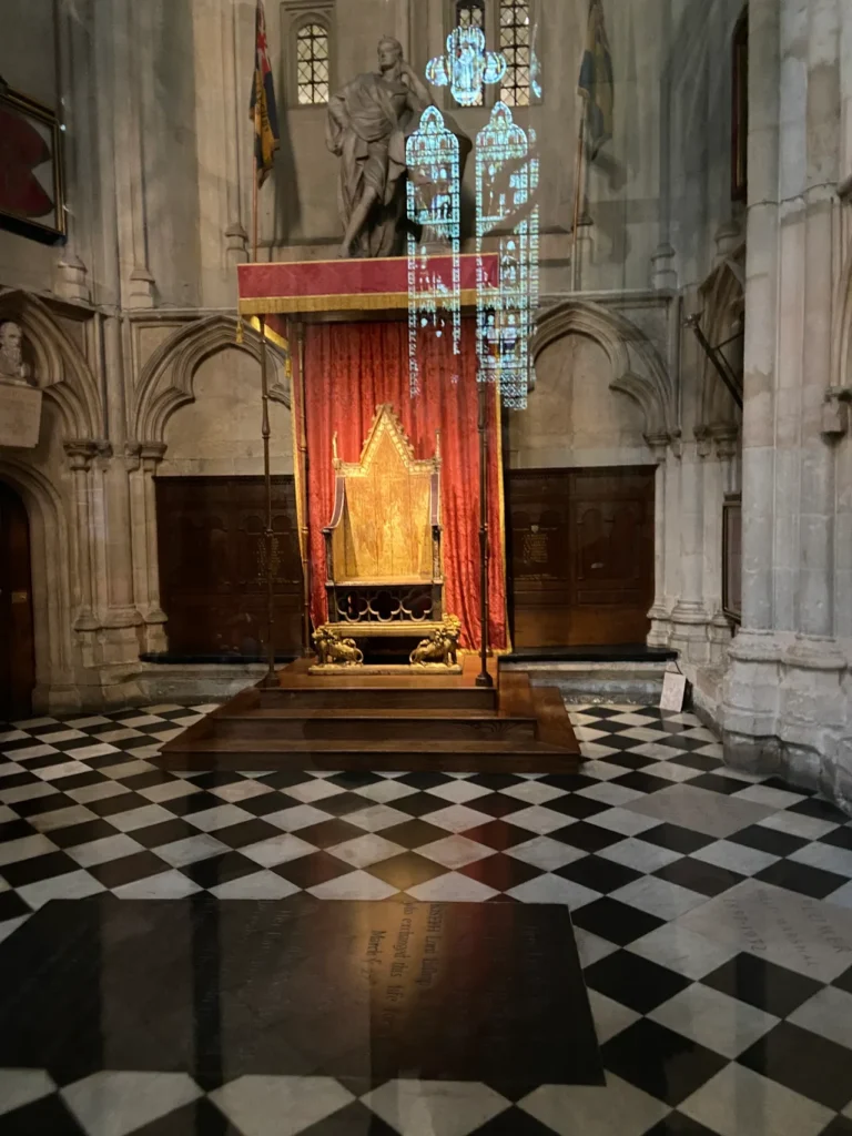 The Coronation Chair is on permanent display at Westminster Abbey. This chair has been a part of every coronation since 1308. The Abbey itself has been a part of every coronation since 1066. The historic wooden Coronation Chair on permanent display behind protective glass inside Westminster Abbey London.
