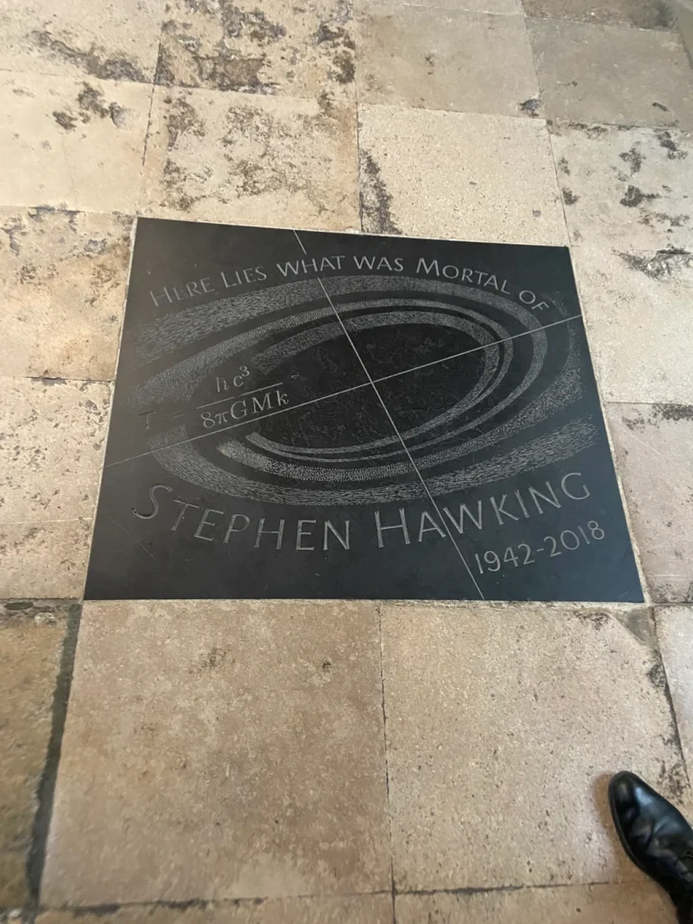 We think of Stephen Hawking as a character on TV’s Big Bang Theory, but his contribution to science is worthy of inclusion with the world best at Westminster Abbey. The dark circular floor grave marker commemorating physicist Stephen Hawking inside Westminster Abbey London.
