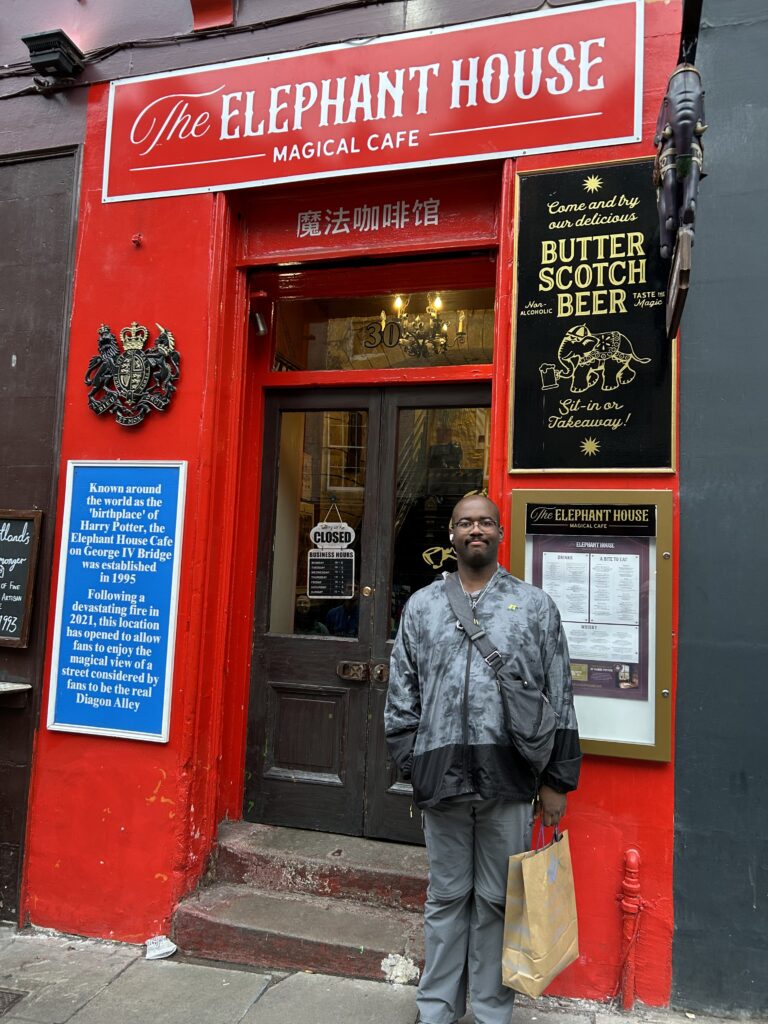 The birthplace of Harry Potter is The Elephant House, a cafe located in Edinburgh. Rowling would set up in the back room and write at the original location. That original location was gutted by a fire, so they've opened up this special location on Victoria Street for fans to visit. The bright red storefront of The Elephant House café on Victoria Street, a key stop on our self-guided Harry Potter walking tour Edinburgh.