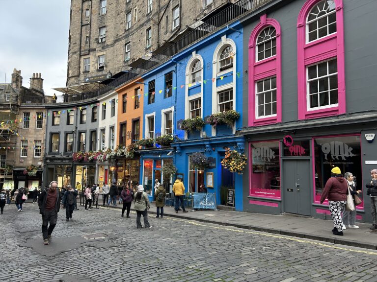 The colorful storefronts of historic Victoria Street, the inspiration for Diagon Alley, featured in our Harry Potter walking tour Edinburgh travel guide.