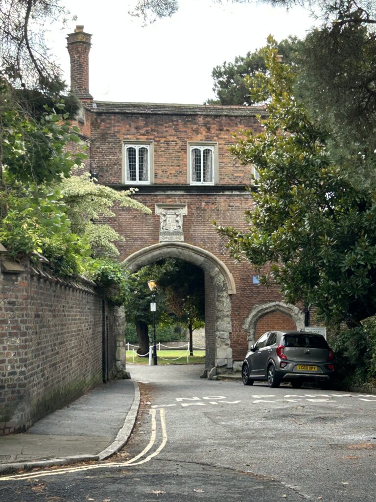 A few structures remain from the once magnificent Richmond Palace. Richmond Palace was once the home of kings and queens from the Tudor family, including Henry VII. The historic brick Gate House structure of the 15th-century Richmond Palace, featured in our Richmond England Ted Lasso walking guide.
