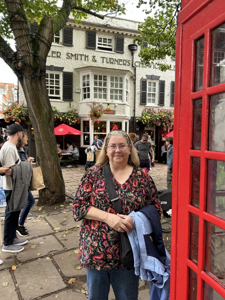 Outside the Ted Lasso pub, the Prince's Head A classic red telephone booth and patio seating outside The Prince’s Head pub, featured in our Richmond England Ted Lasso walking guide.
