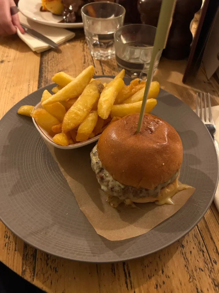 Monterey Jack Cheddar cheese is featured on the cheeseburger served at the Prince's Head in Richmond. A gourmet cheeseburger with melted Monterey Jack Cheddar served with triple-cooked chips at The Prince's Head, the real Ted Lasso pub in Richmond.