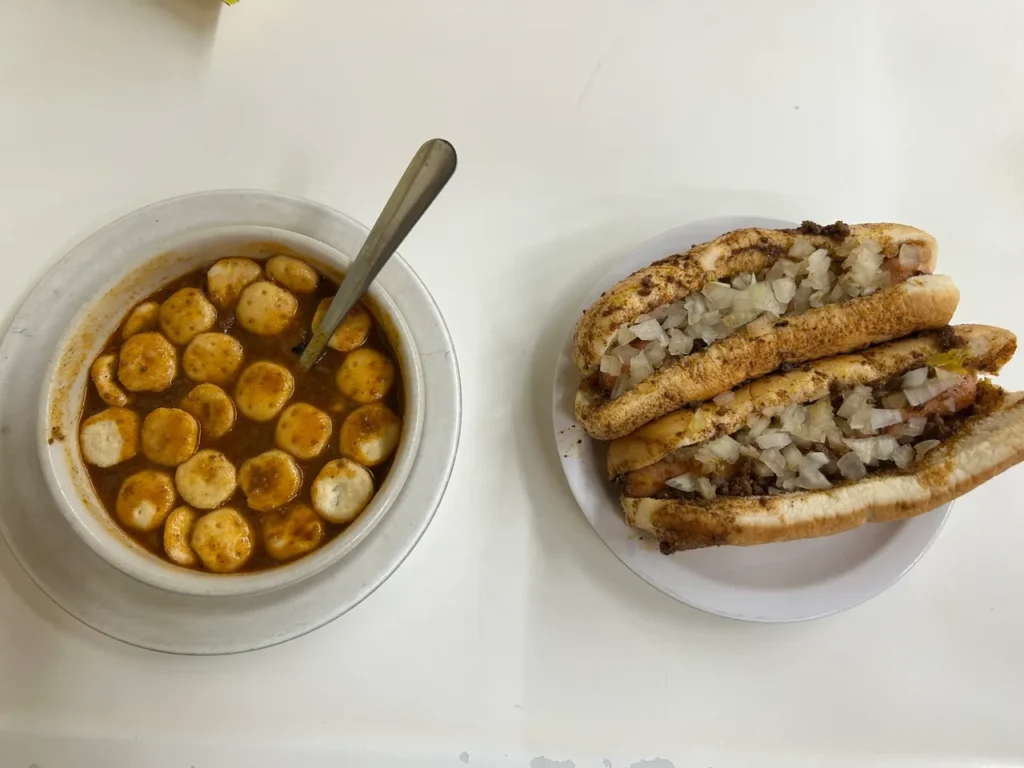 The perfect combo meal at Coney Island in Fort Wayne, a cup of chili and a pair of coney dogs with mustard. The exact meal has been their best seller at Coney Island for well over one hundred years. A perfect combo meal featuring a cup of chili and two coney dogs with mustard from America's oldest hot dog stand.