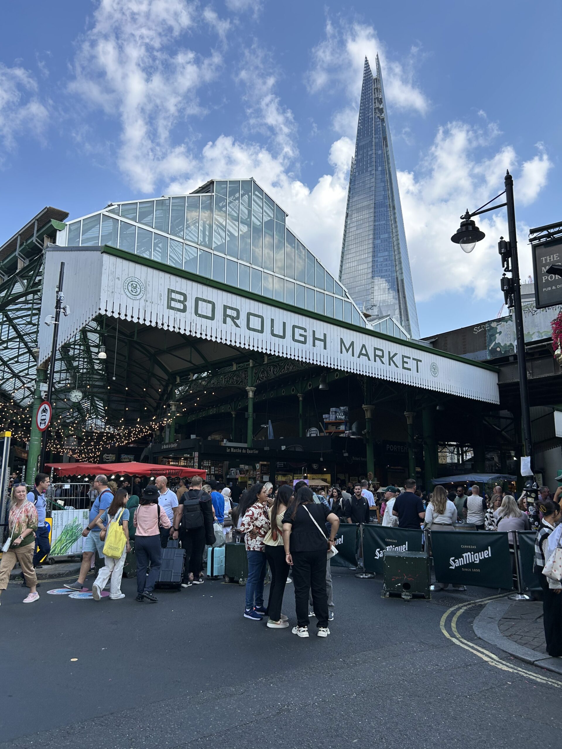 The iconic green art deco entrance glass facade of London's Borough Market, a top food destination in England.