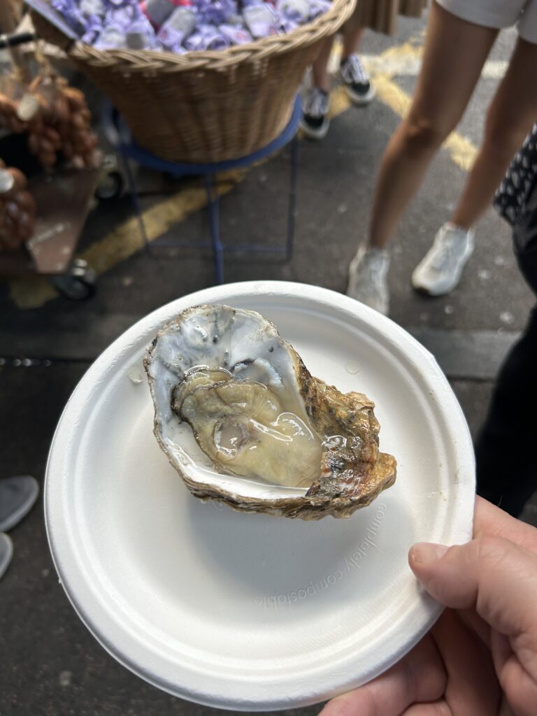Richard Haward Oyster Shop in Borough Market, London A giant freshly shucked oyster served on a plate at Richard Haward's Oyster Shop inside London's Borough Market, a top food destination.