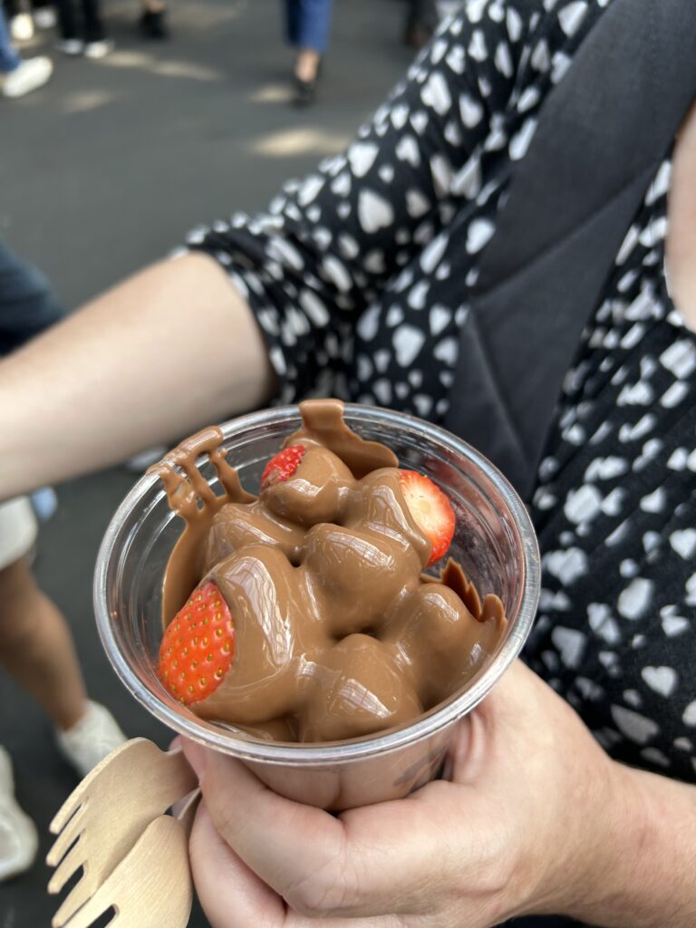 chocolate covered strawberries from Turnips in Borough Market, London Ripe fresh strawberries covered in warm melted milk chocolate in a cup from Turnips at London's Borough Market, a top food destination.