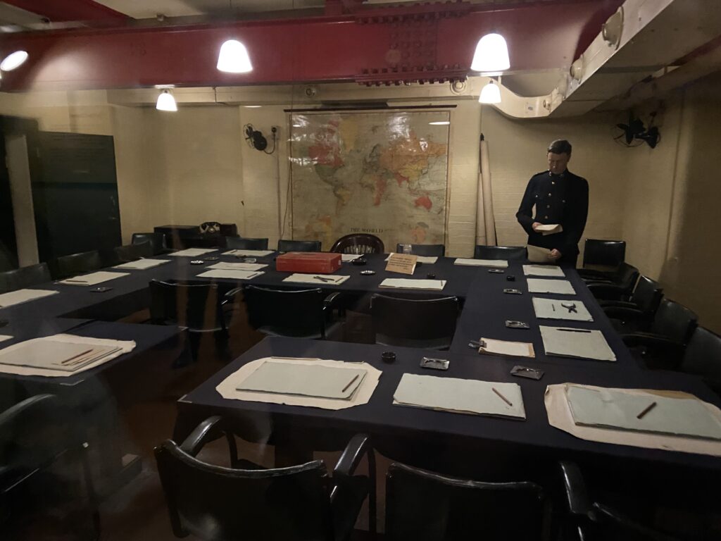 Inside the Churchill War Rooms in London, one of the rooms where meetings were conducted to work on strategy to fight and win the war vs. the Germans. The historic underground strategy meeting room inside the Churchill War Rooms in London, featured in our Winston Churchill across England travel guide.