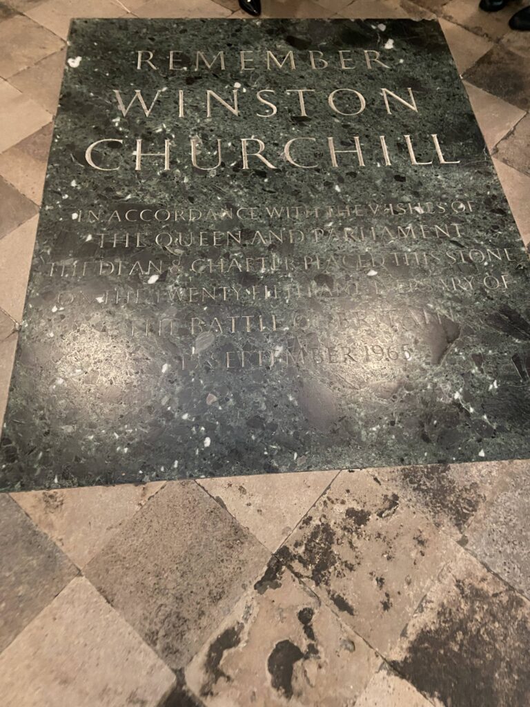 A memorial for Winston Churchill at Westminister Abbey. Fittingly, this is located near the Tomb of the Unknown Warrior. The green marble Winston Churchill memorial stone embedded in the floor of Westminster Abbey, featured in our Winston Churchill across England travel guide.