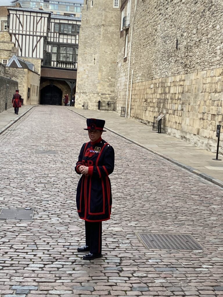 Moira Cameron, the historic second female Beefeater at the Tower of London, serving as our tour guide.