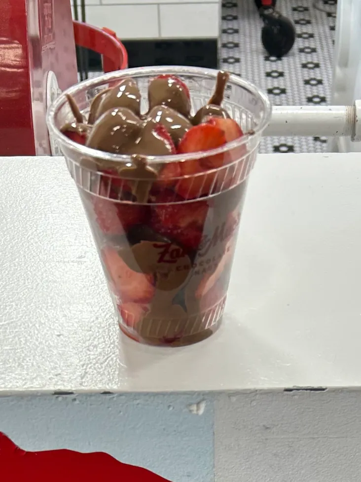 Zac and Mac’s in downtown Frankenmuth features this show-stopper of a dessert. A cup of fresh cut strawberries with your choice of either milk or dark chocolate is the perfect dessert to enjoy as you walk from shop to shop. A cup of fresh chocolate-covered strawberries from Zak and Mac's chocolate shop during a Frankenmuth Michigan Christmas trip.