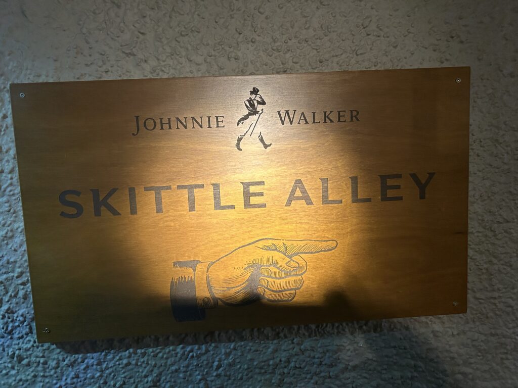 Through the dining area and past the courtyard are two skittle lanes. They are reportedly the last two such skittle lanes in existence. The vintage Johnnie Walker Skittle Alley sign mounted on the wall at The Sheep Heid Inn Edinburgh, marking Scotland's oldest bowling lanes.