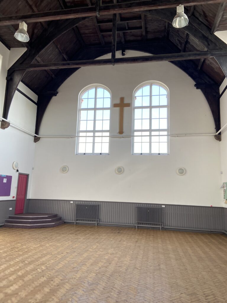 The St. Peter's Church Hall in Liverpool was the site where Paul and John first met officially. John was performing as a member of the Quarrymen. Paul was there to meet John and maybe meet some girls. The interior of St. Peter's Church Hall in Liverpool where John Lennon and Paul McCartney first met, a key moment featured in our Beatles breakup and Disney World article.
