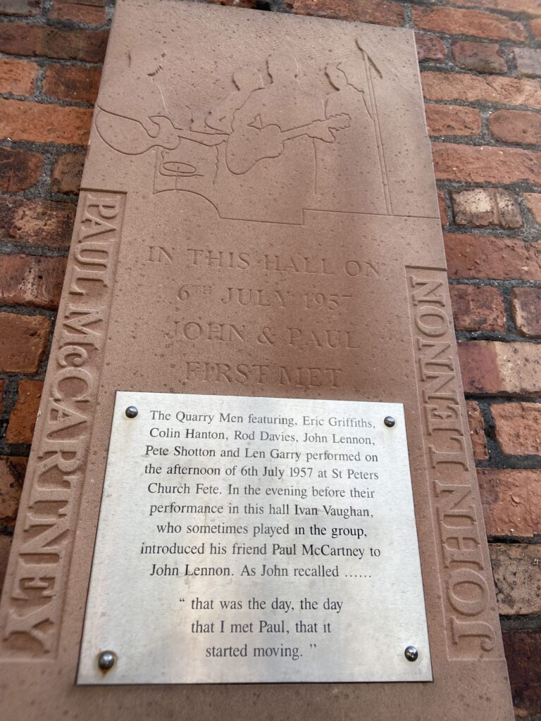 A plaque on the outside of the hall at St. Peter's church in Liverpool that memorialized that fateful summer day with Lennon finally met McCartney. The historic stone and silver plaque commemorating where John Lennon and Paul McCartney first met, featured in our Beatles breakup and Disney World article.