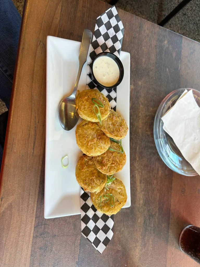 Fried green tomatoes from GAS - Full Service Restaurant in St. Augustine, Florida A plate of crispy fried green tomatoes served with buttermilk ranch dipping sauce at GAS Full Service Restaurant, featured in our St. Augustine restaurants guide.