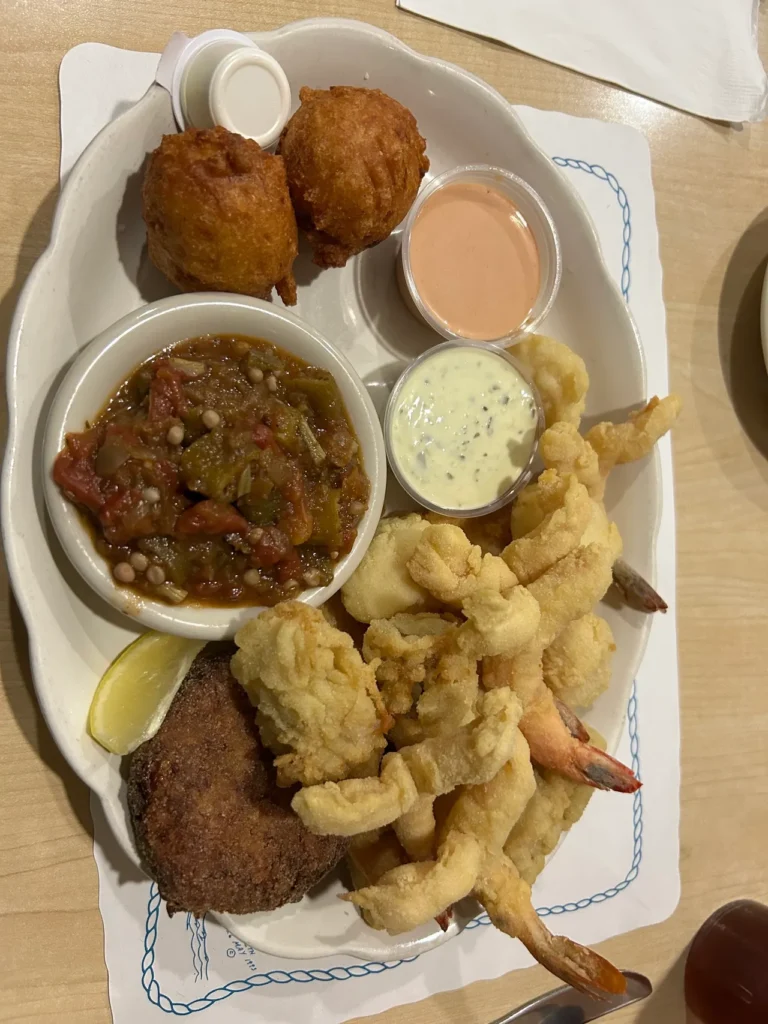 Fried seafood from O'Steen's Restaurant in St. Augustine, Florida A massive fried seafood platter featuring cracker-meal-breaded shrimp, fish, oysters, scallops, and sides at O'Steen's Restaurant, a highlight of our St. Augustine restaurants guide.