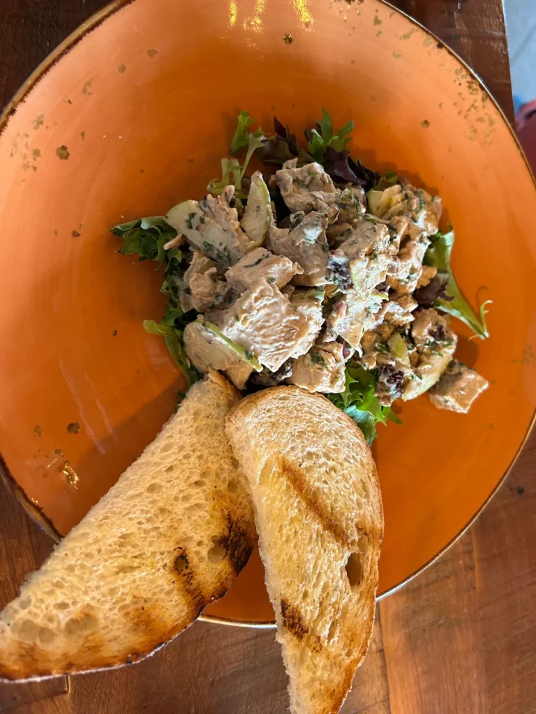 Chicken salad at River & Fort in St. Augustine, Florida Honey grilled chicken salad served with a sweet tarragon-basil aioli and grilled sourdough bread at River & Fort, a highlight of our St. Augustine restaurants guide.