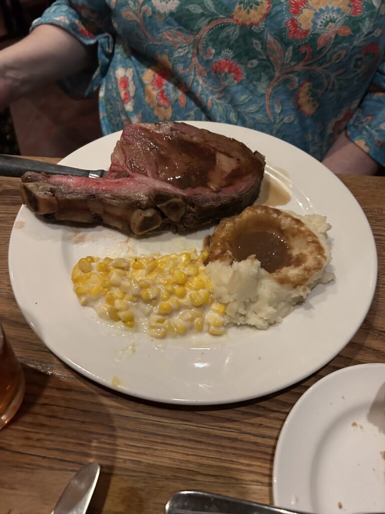 Tam O'Shanter's prime rib is what they are best known for, and it does not disappoint. Served with mashed potatoes, gravy, yorkshire pudding, and creamed spinach or creamed corn. A thick cut of roasted prime rib served with mashed potatoes, gravy, and creamed corn at the Tam O'Shanter Inn Los Angeles.