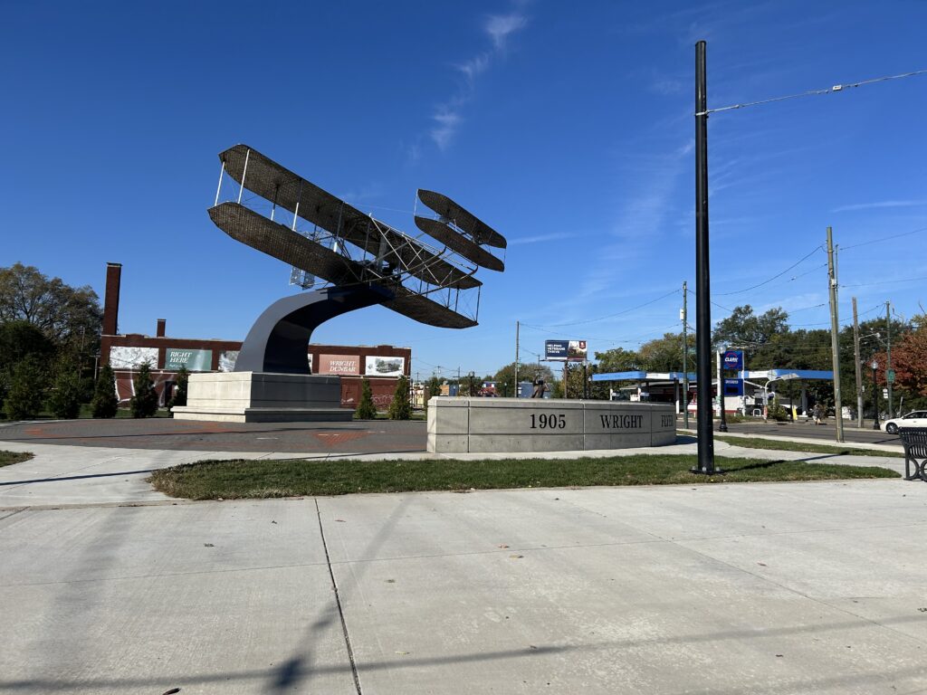 Dayton embraces their aviation history. That includes this display of public art, near the visitor’s center of a Wright Flyer. A large outdoor public art sculpture of the Wright Flyer airplane silhouette, celebrating Dayton Ohio aviation history.