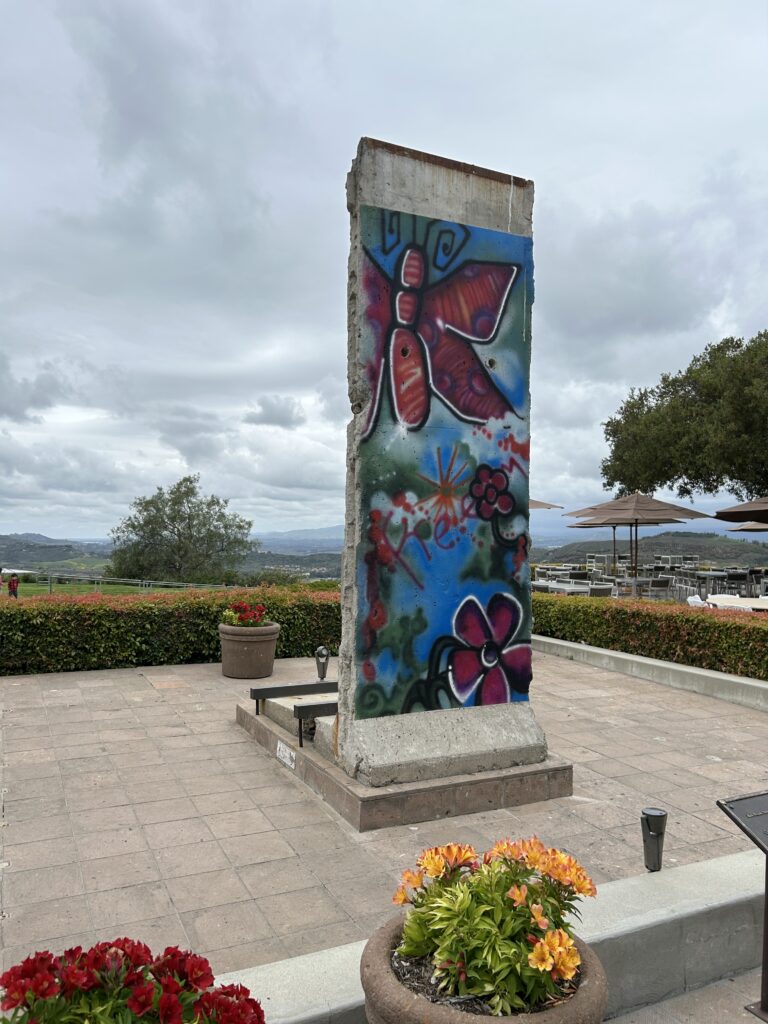 A piece of the Berlin Wall at the Reagan Presidential Museum An authentic piece of the Berlin Wall on outdoor display at the Ronald Reagan Presidential Museum in California.
