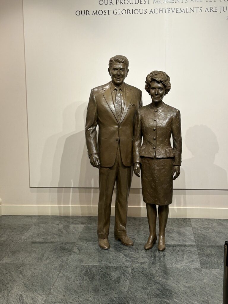 Artwork featuring the Reagans is presented throughout the museum, including this sculpture of the Reagans that greets you at the beginning of the tour. A detailed bronze sculpture of Ronald and Nancy Reagan welcoming visitors at the entrance of the Ronald Reagan Presidential Museum.