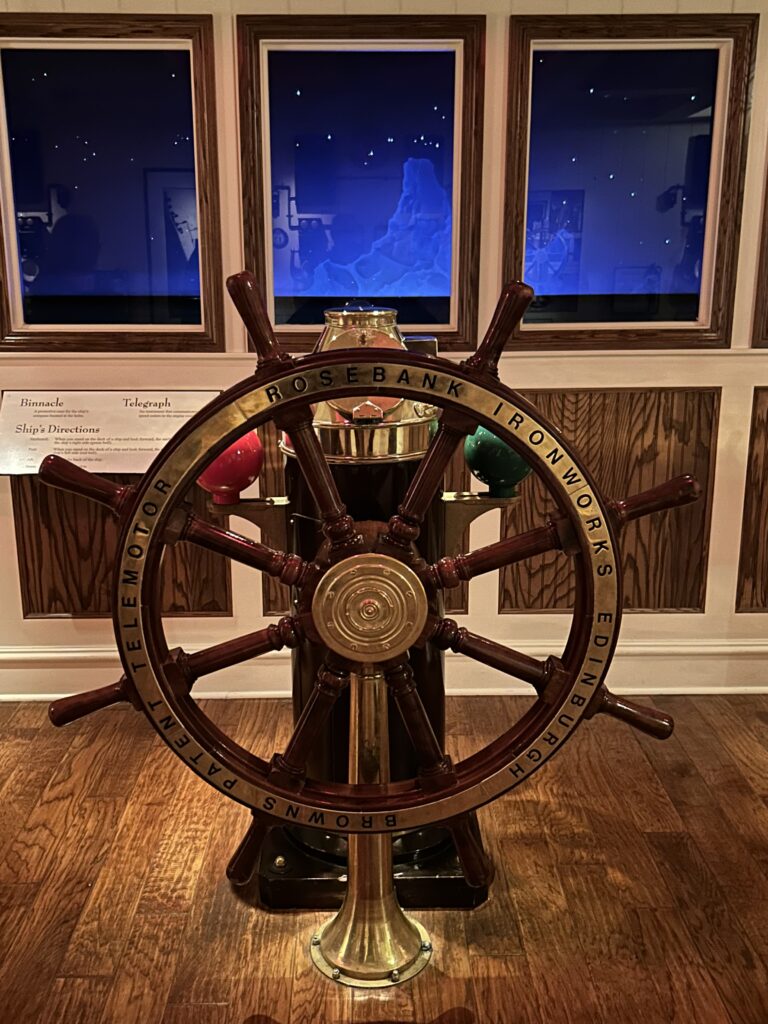 A replica of the Titanic bridge gives you a sense for what the crew saw the night they hit the iceberg. The authentic wooden ship steering wheel and brass telemotor on the replica bridge at the Titanic Museum Pigeon Forge.
