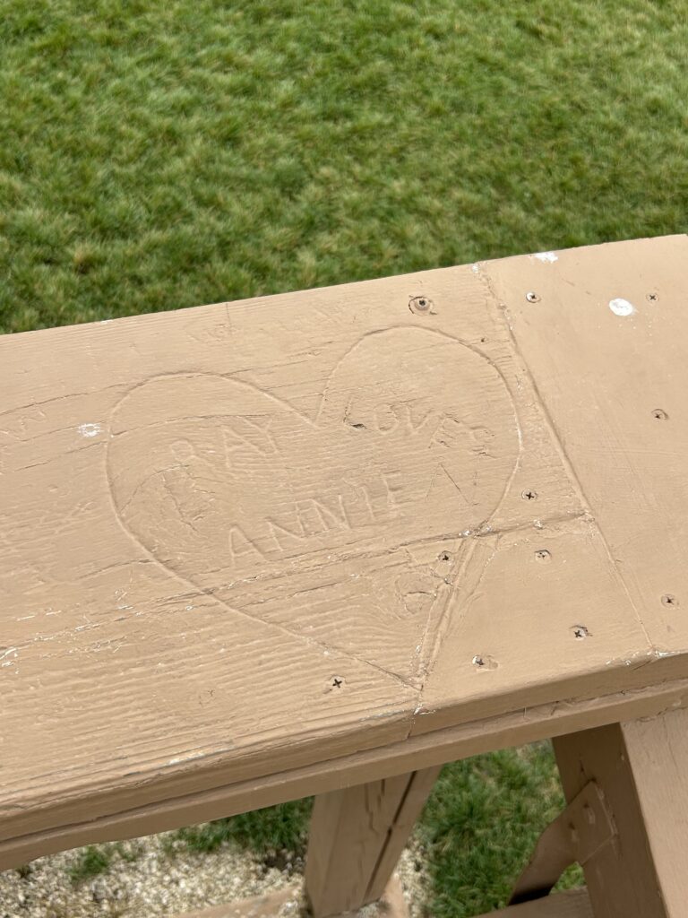 A little hard to read, but the carving spells out “Ray loves Annie” which was featured in the film. The carving was actually done by actor Kevin Costner while filming Field of Dreams.