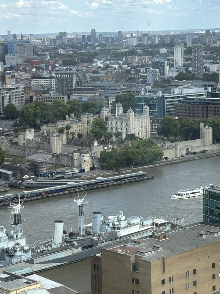 You can sit and watch river traffic on the Thames float by as you enjoy your afternoon tea. The views include the unique perspective to look down on the Tower of London, situated on the river bank just north of The Shard. The impressive historic sprawl of the Tower of London viewed from above during the Peter Pan tea at The Shard.