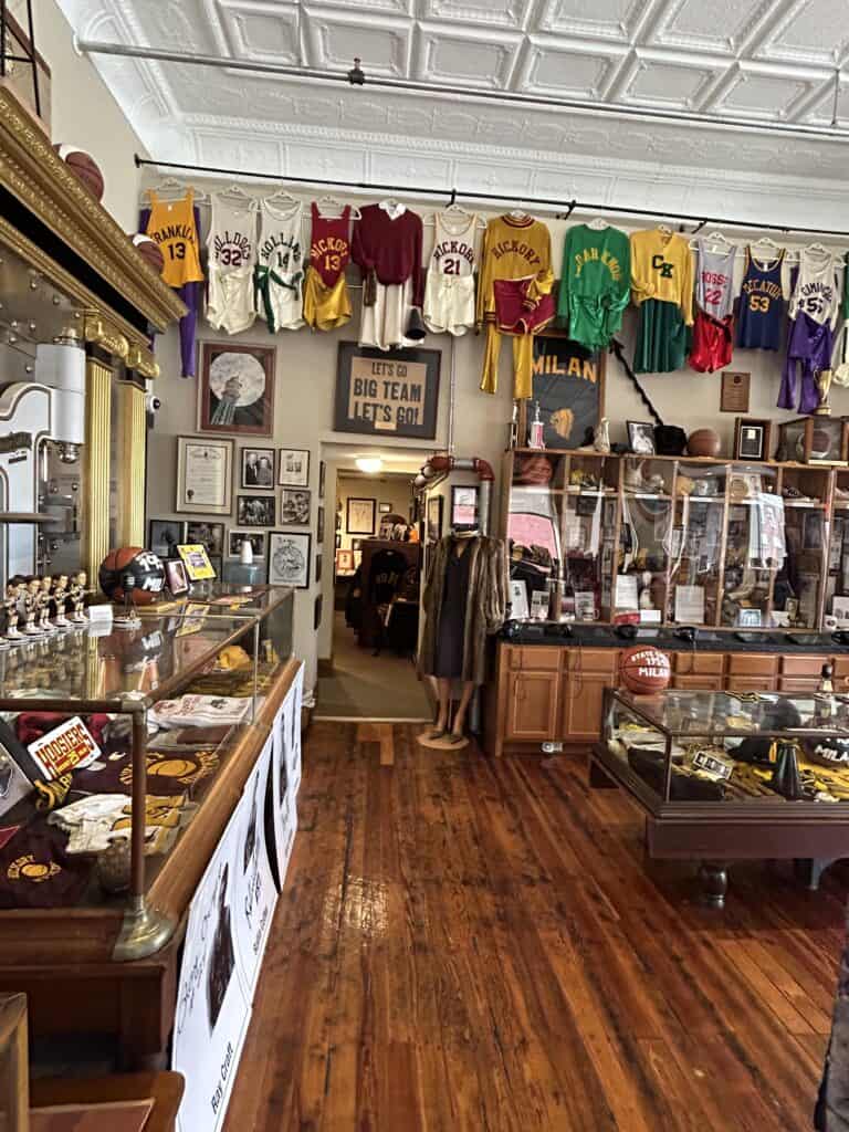 Rows of authentic black and gold vintage player jerseys inside the 1954 Milan basketball Indiana museum.