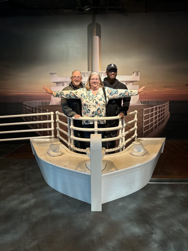 Recreated front of the Titanic A group photo of visitors posing at the recreated front bow of the ship, a fun photo opportunity highlighted in our Titanic Belfast review.