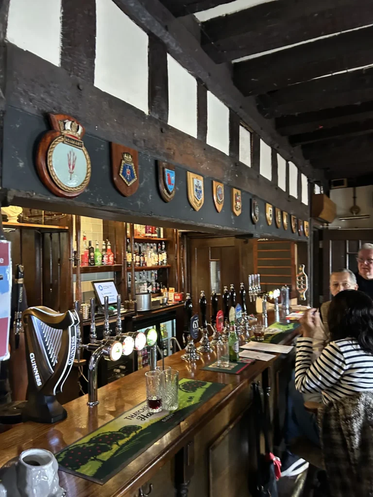 A favorite pub for locals and visitors is the Duke of Wellington Pub in Southampton. If you're in town on Sunday, be sure to check out their Sunday roast. Interior wall plaques and historic wood paneling inside the Duke of Wellington Pub, featured in our Southampton England travel guide.