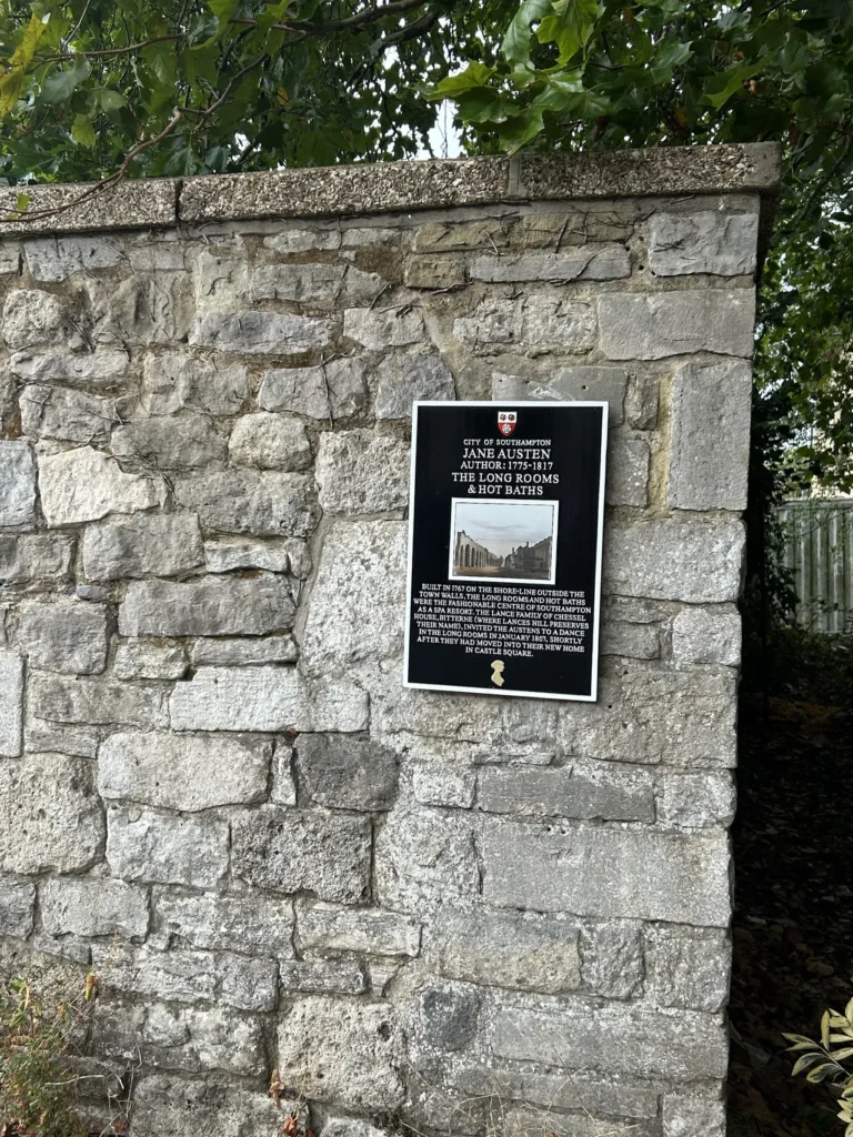 Jane Austen plaque in Southampton A black historical plaque detailing author Jane Austen's residency in the city, from our Southampton England travel guide.