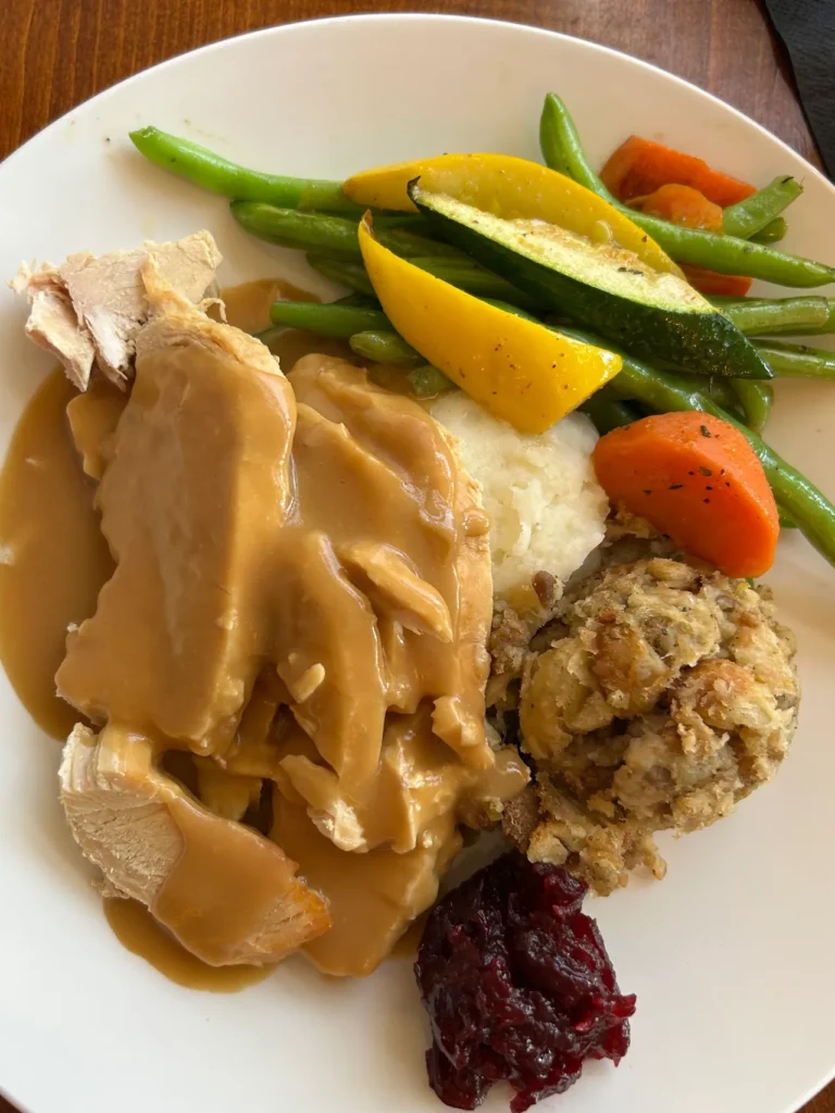Our favorite meal at the Golden Lamb is the roast turkey and dressing. At our next Thanksgiving meal, we'll be longing for this dinner from the Golden Lamb. A traditional roast turkey dinner with sage sausage apple dressing, mashed potatoes, and rich brown gravy at The Golden Lamb in Ohio.